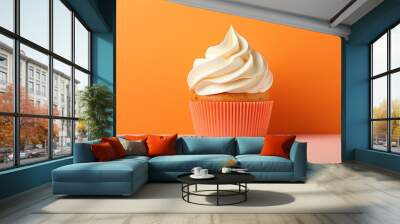  a cupcake with white frosting on an orange background.  generative ai Wall mural