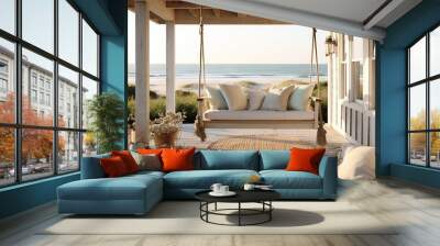  a porch with a swing chair and pillows on the front porch of a beach house with a view of the ocean in the distance,.  generative ai Wall mural