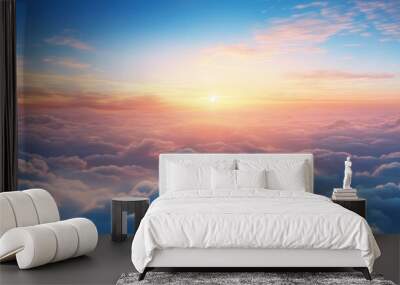  the sun shines brightly above the clouds in this view of a blue sky with pink and yellow hues. Wall mural