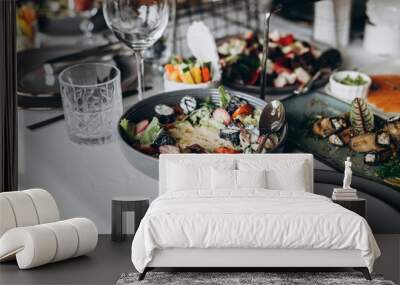 A variety of food on the table, fish, olives, bread, raspberries, meat Wall mural