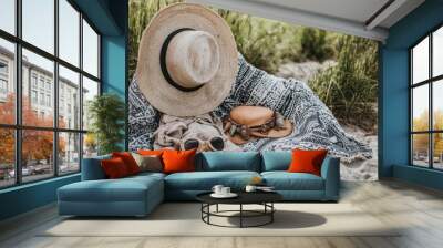 Beach Picnic Essentials. Straw Hat, Sunglasses, Blanket, and Accessories in Sand Dunes Wall mural