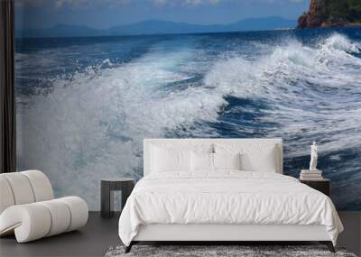 boat ride on the sea, exotic James Bond islands against the blue sea, waves of spray in Thailand Wall mural