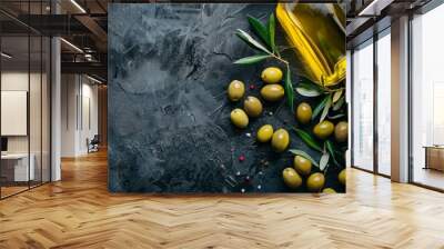 Bottle of olive oil with fresh olives and leaves on a minimalist background for healthy cooking Wall mural