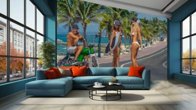 Boy and girls surfers having fun Wall mural