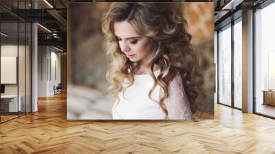 Natural portrait of bride with long blonde curly hair Wall mural