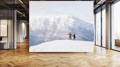 Tourists in mountains on the background of snow-capped peaks. Clean snow and nice weather Wall mural