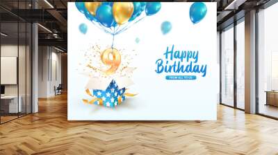 Celebrating of 9 th years birthday vector 3d illustration. Ninth anniversary celebration. Open gift box with explosions confetti and number nine flying on balloons on light background Wall mural