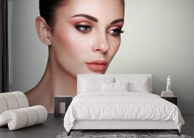 Beautiful Young Woman with Clean Fresh Skin. Perfect Makeup. Beauty Fashion. Eyelashes. Cosmetic Eyeshadow. Highlighting. Cosmetology, Beauty and Spa Wall mural