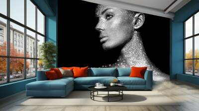 Fashion model woman in bright sparkles and lights posing in studio. Portrait of beautiful sexy woman. Art design glitter glowing make up. Black and white photography Wall mural