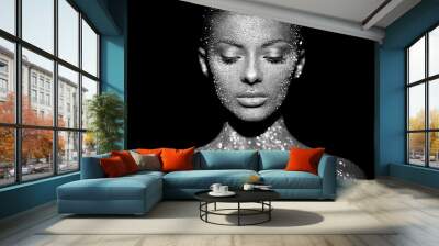 Fashion model woman in bright sparkles and lights posing in studio. Portrait of beautiful sexy woman. Art design glitter glowing make up. Black and white photography Wall mural