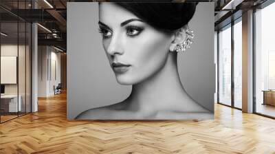 Fashion portrait of young beautiful woman with jewelry and elegant hairstyle. Brunette girl. Perfect make-up.  Beauty style woman with diamond accessories Wall mural