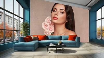 Portrait beautiful young woman with clean fresh skin. Model with healthy skin, close up portrait. Cosmetology, beauty and spa. Girl with a rose flower Wall mural