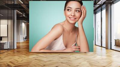 Portrait beautiful young woman with clean fresh skin. Model with healthy skin, close up portrait. Cosmetology, beauty and spa Wall mural