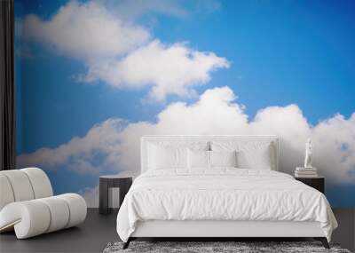 White and gray fluffy clouds against the blue sky Wall mural