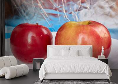 Two red bright juicy ripe apples lie side by side on a white plate. fruits and vegetables. vitamin c. energy of nature Wall mural