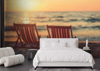 Sunset on Beach with Two Empty Deck Chairs Wall mural