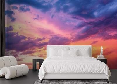 sunset sky clouds in the evening with red orange yellow and purple sunlight on golden hour after  Wall mural