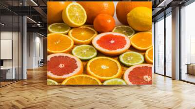 Citrus fruit background with sliced f oranges lemons lime tanger Wall mural