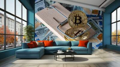 Golden cryptocurrency coins bitcoin in a mousetrap on the background of us 100 dollar bills, closeup. Cryptocurrency scam or fraud concept Wall mural