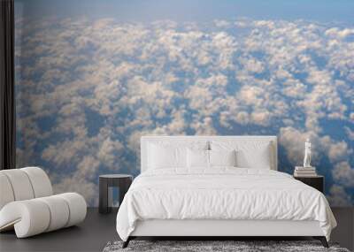 White clouds and blue sky, a view from airplane window Wall mural