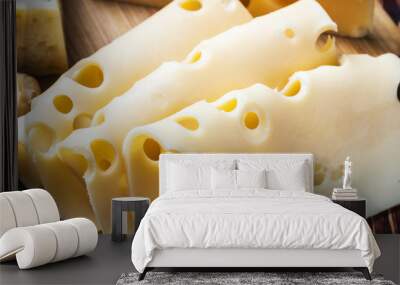 Fresh cut maasdam cheese. Vignette as artistic effect Wall mural