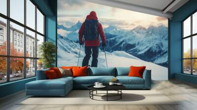 A skier in a bright orange jacket carves through fresh powder snow on a sunny winter day Wall mural