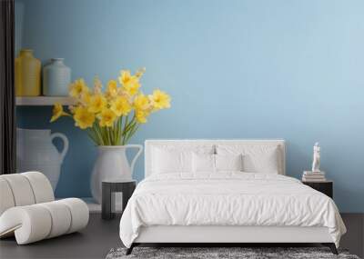 Bright yellow flowers in a vase on a white shelf Wall mural