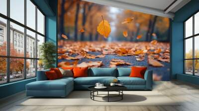 Colorful autumn leaves falling on a quiet street during a serene afternoon in the park Wall mural