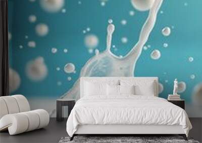 Dynamic water splash creating the number two against a vibrant blue background Wall mural