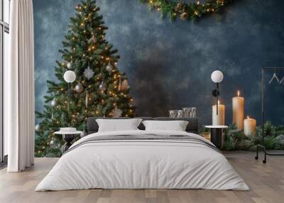 Elegant holiday decoration with a Christmas tree and candles in a cozy setting Wall mural