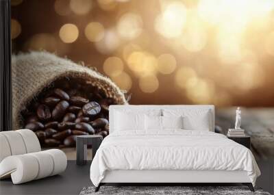 Freshly roasted coffee beans spill from a burlap sack on a wooden table outdoors in daylight Wall mural