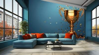 Gold Trophy With Confetti Against Blue Background Wall mural