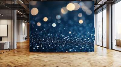 Stunning blue and gold bokeh sparkle effect created by light reflections in a dark space Wall mural