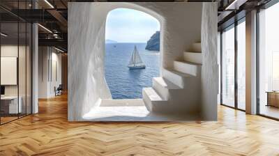 Stunning coastal view from an elegant staircase overlooking sailboats in the tranquil sea Wall mural