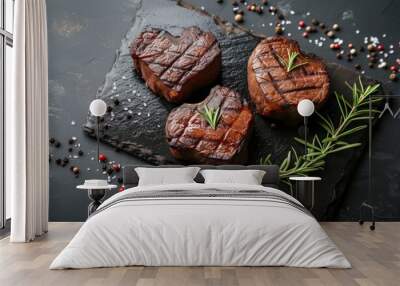 two beef steaks with hearts on black board background Wall mural