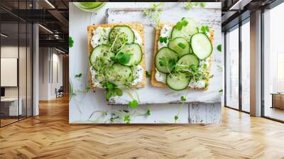 two crackers with vegetables and cucumbers on a board Wall mural