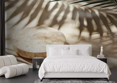 Two Round Stone Platforms With Palm Leaf Shadows on White Marble Surface Wall mural