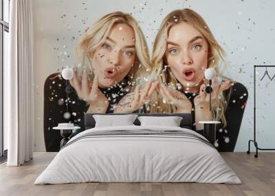 Two Women Making Funny Faces With Their Hands Wall mural