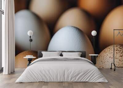 Various eggs in different shades arranged closely together on a dark surface Wall mural