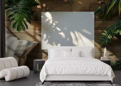 White Blank Canvas on Wooden Floor With Greenery and Natural Light Wall mural