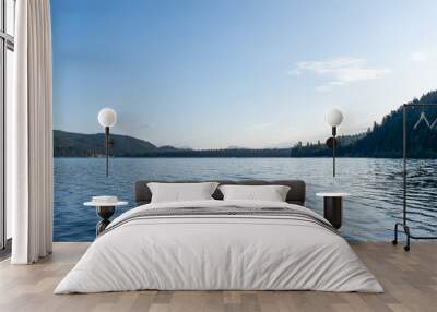 day time on mountain lake with calm water and cloudy sky Wall mural