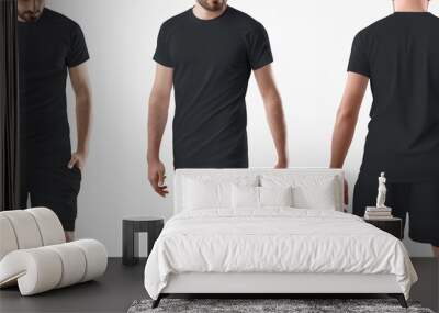 Mockup of a black t-shirt, shorts with a compression line of underpants, on a sporty man isolated on background, front, back view. Wall mural