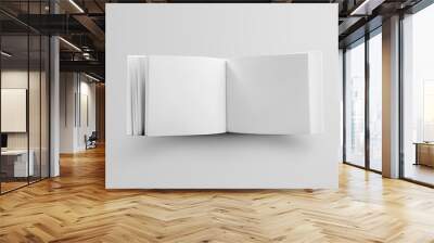 Template of a white book landscape orientation, standing and open in the middle, a standard object for the presentation of design and pattern. Wall mural