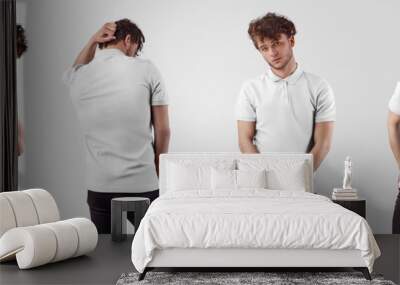 White polo mockup, on young stylish guy, front and back view, isolated on background. Wall mural