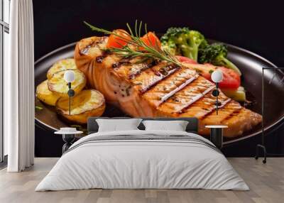 Grilled salmon fillet with baked potatoes, broccoli and other vegetables on a black background Wall mural