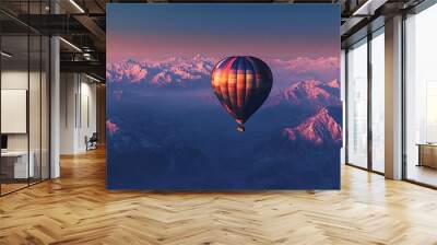 Hot air balloon drifts above snowy mountains at sunset, creating a colorful sky. This serene scene inspires travel and adventure Wall mural