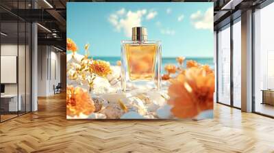 Perfume bottle is standing on white rocks surrounded by bright orange flowers, with the ocean and blue sky in the background Wall mural