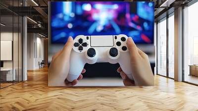 Person holding gaming console controller playing video game Wall mural