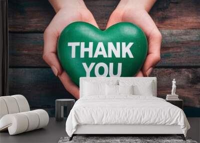 Heartfelt Appreciation Top View of Hand Holding Heart with 'Thank You' Message Wall mural