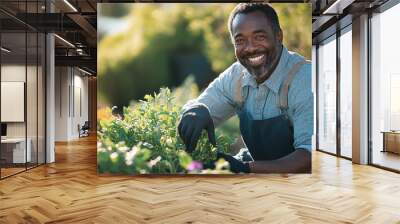 A man smiles as he tends to his plants on a sunny day Wall mural